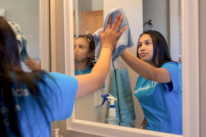 Alpine Maids Cleaning Tech Washing Mirror